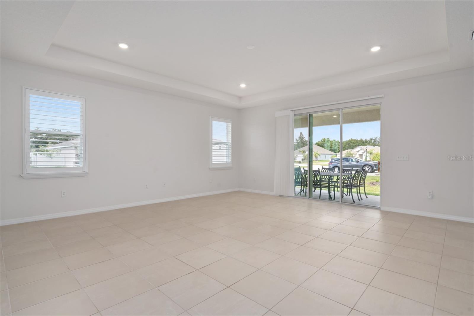 Great Room with Tray ceiling and access to covered lanai.