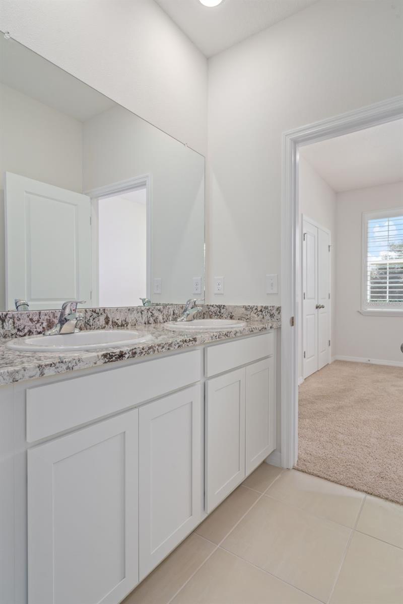 Double sink Jack n Jill bath between bedrooms 2 and 3