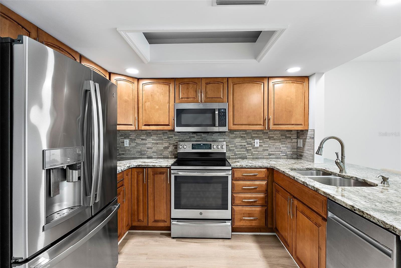 Top of the line appliances with with built in Keurig in the refrigerator.