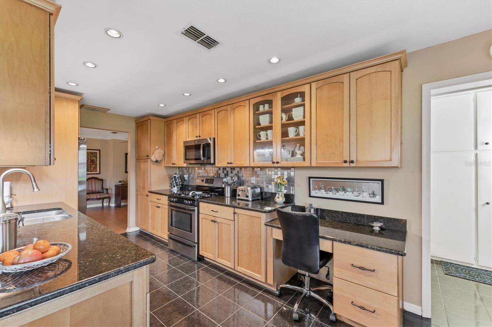 Bult in desk and custom glass front cabinets!