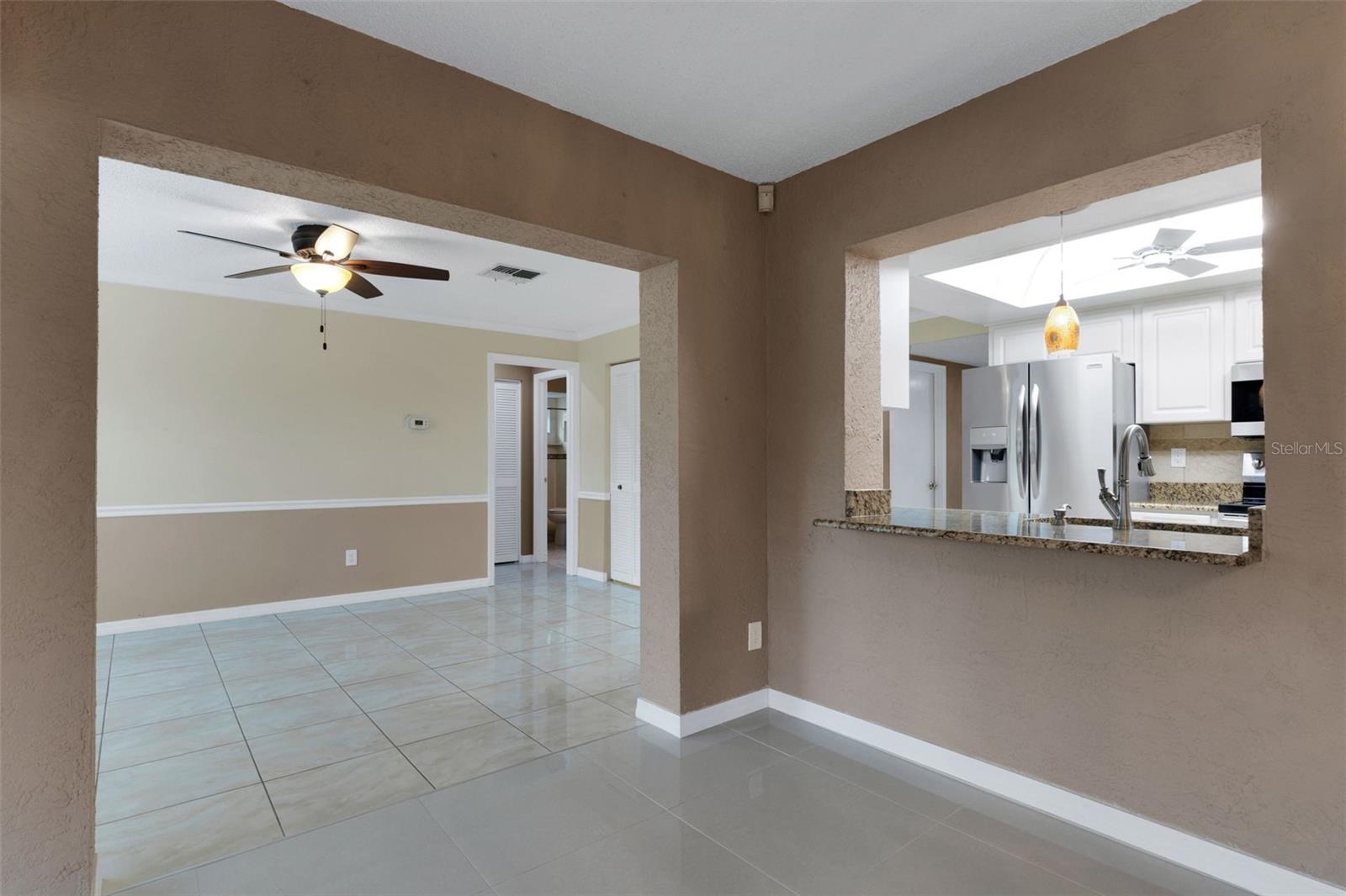Kitchen open to Den, dining room and living room