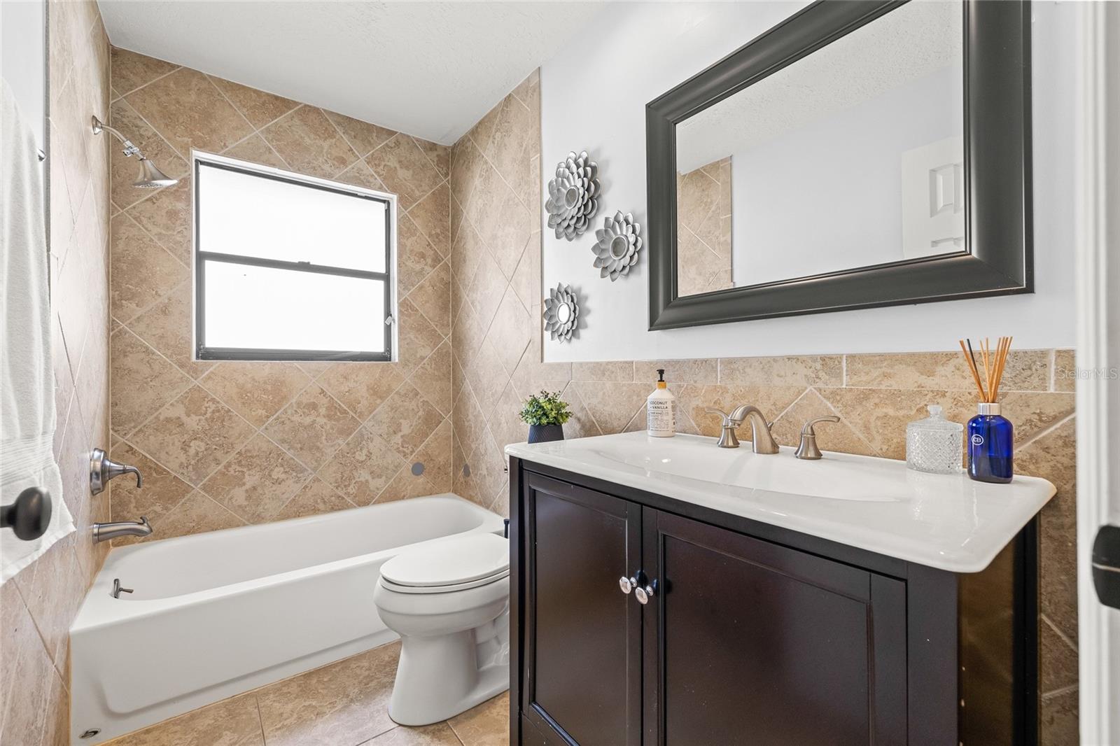 Shared full bath between bedroom 2 and 3.