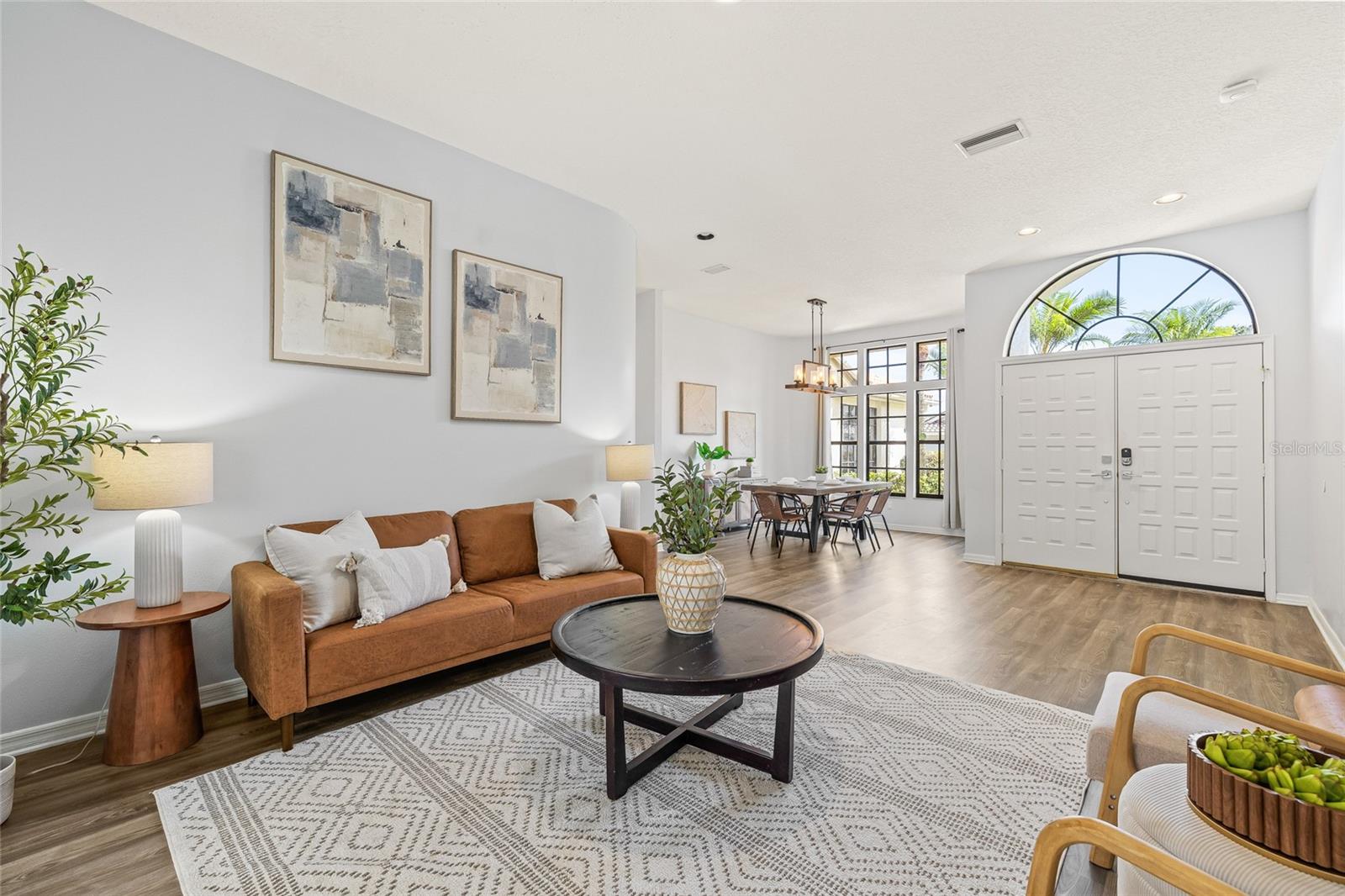 Walk through the front double doors to a spacious second living/TV room.
