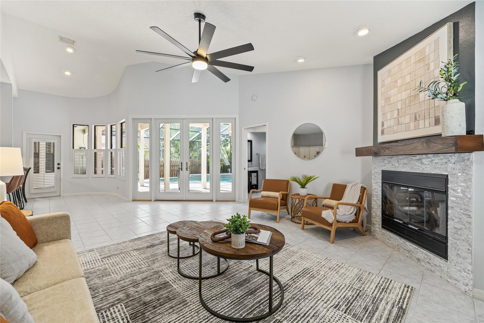 The hearth room with a wood burning fireplace flows to the kitchen and dinette.