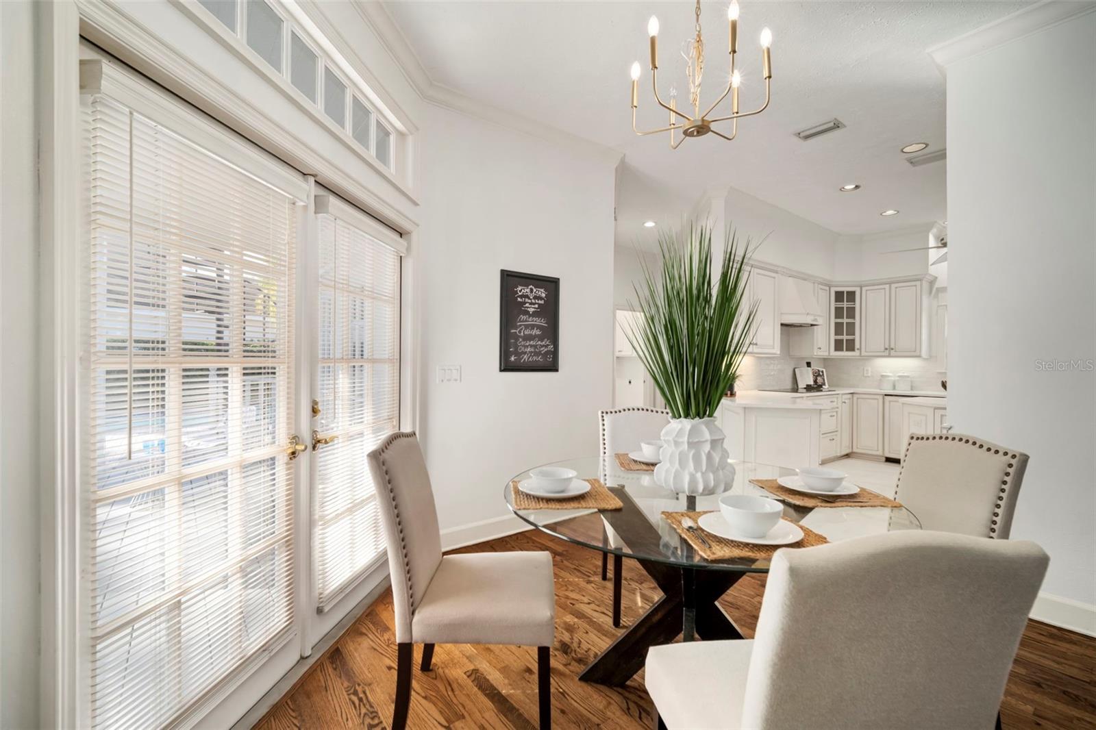 LOVELY BAYED LIVING ROOM.   GLOWING HARDWOODS THROUGHOUT