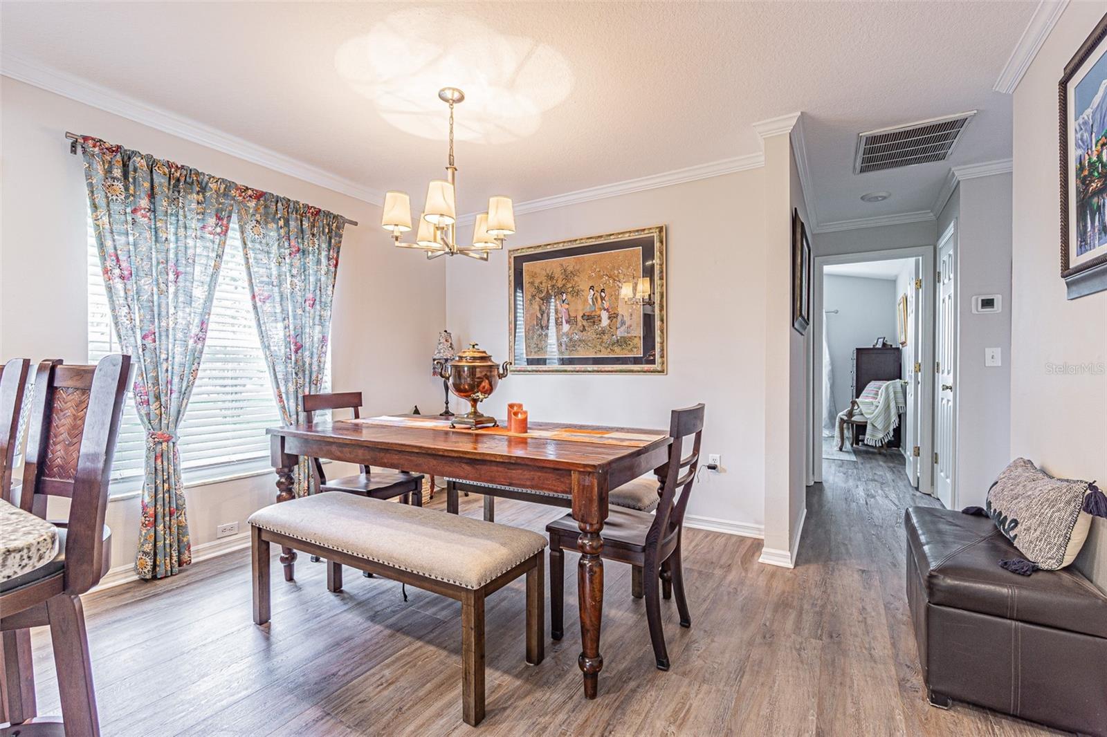 Dining area with large window open to kitchen