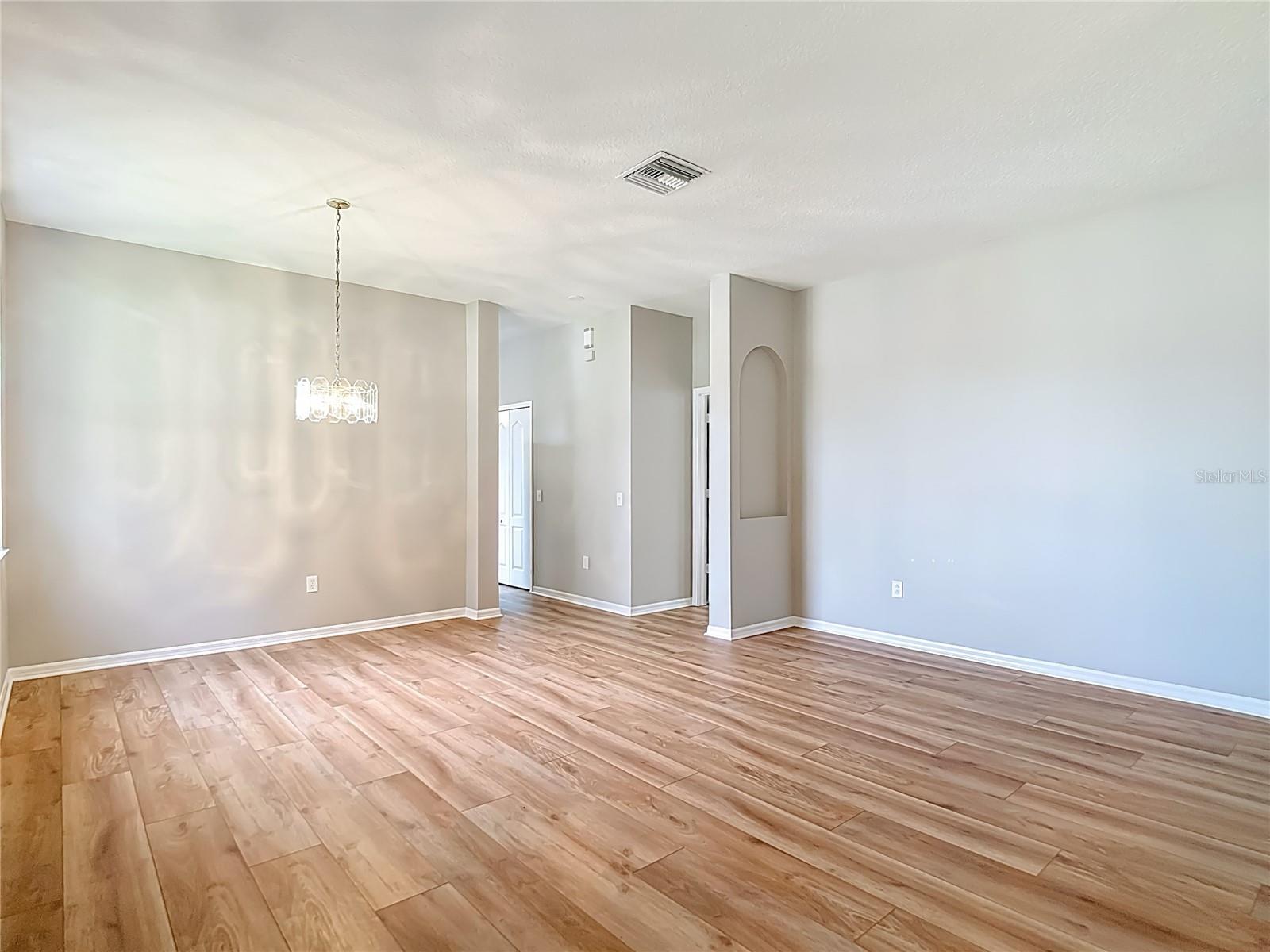 Living / Dining Room Combo.  Primary Bedroom to the right.