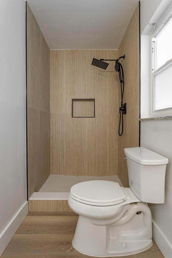 Master Bath with walk-in Shower Teak like tile walls and Rain shower head