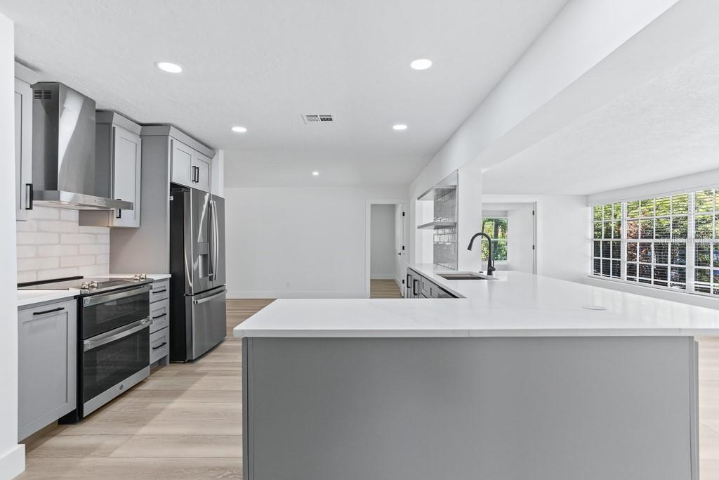All wood cabinets and stainless steel appliances.