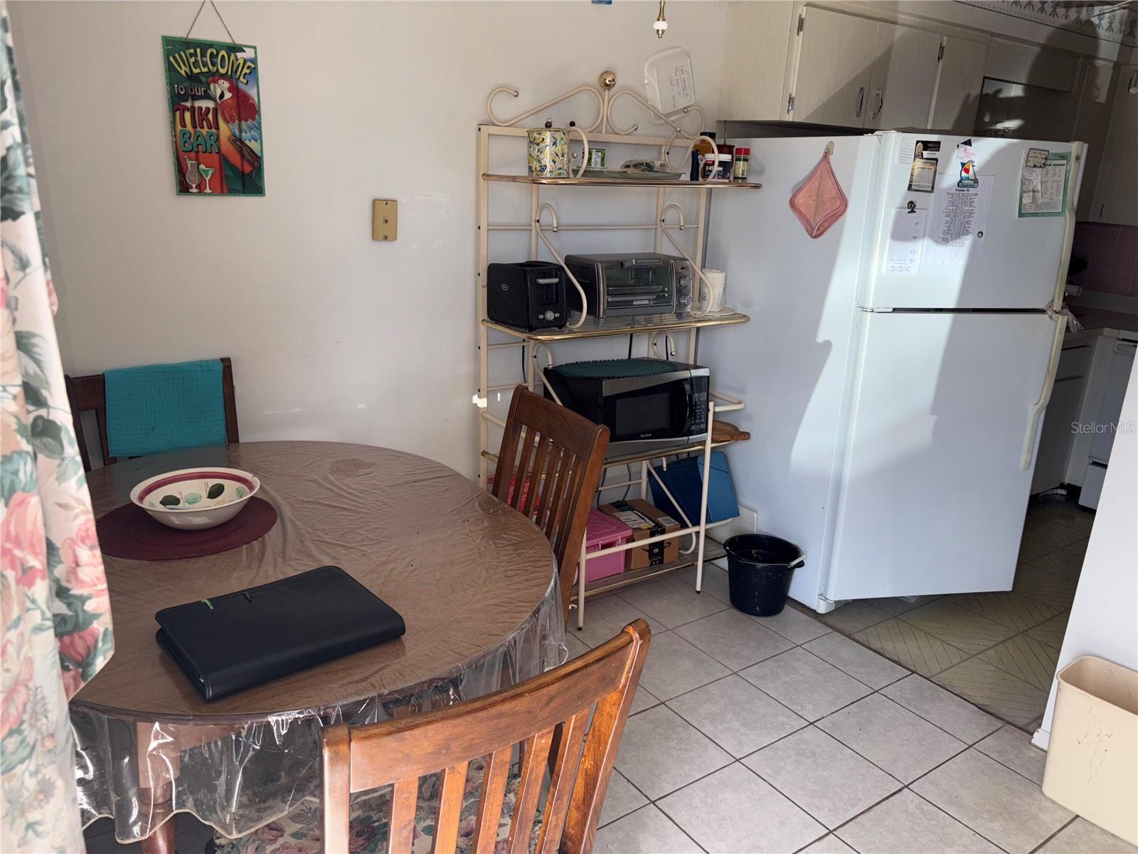 View of dining area looking into kitchen.
