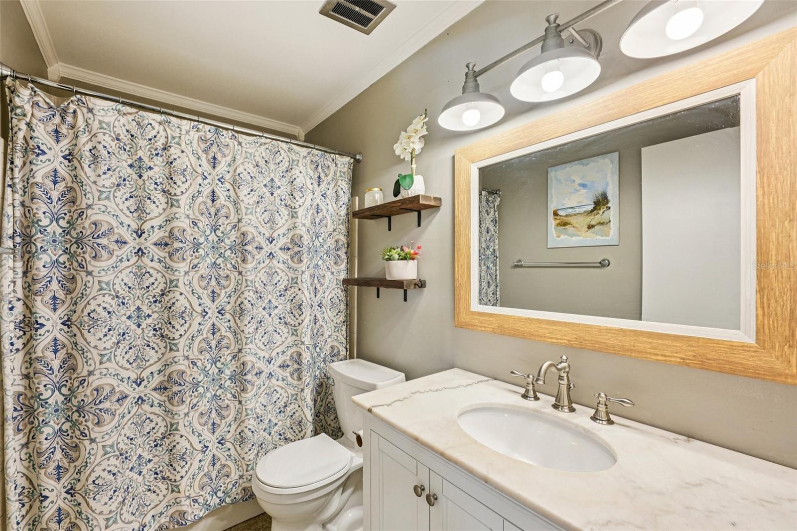 Main bathroom with tub and showerhead