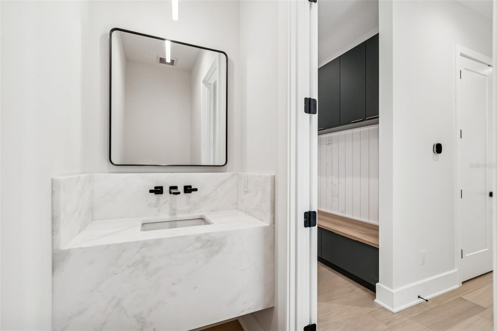 Powder bath off the living room area - leading to mud room