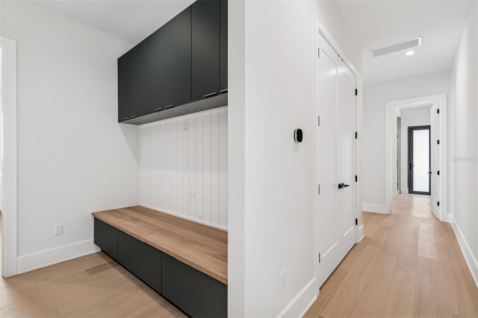 Mud room facing hallway to pool bath