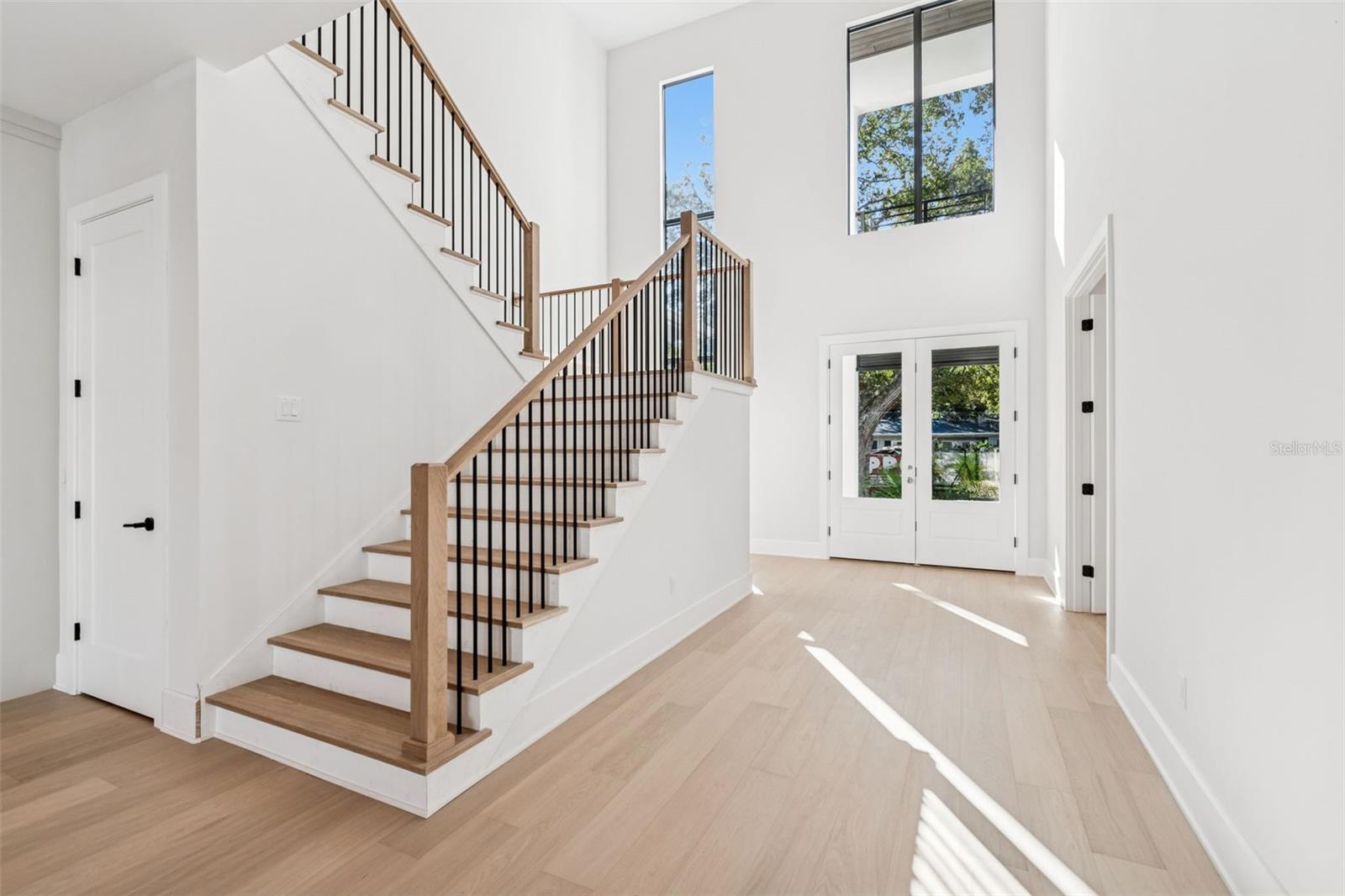 back to two story foyer - office to the right and formal dining to the left