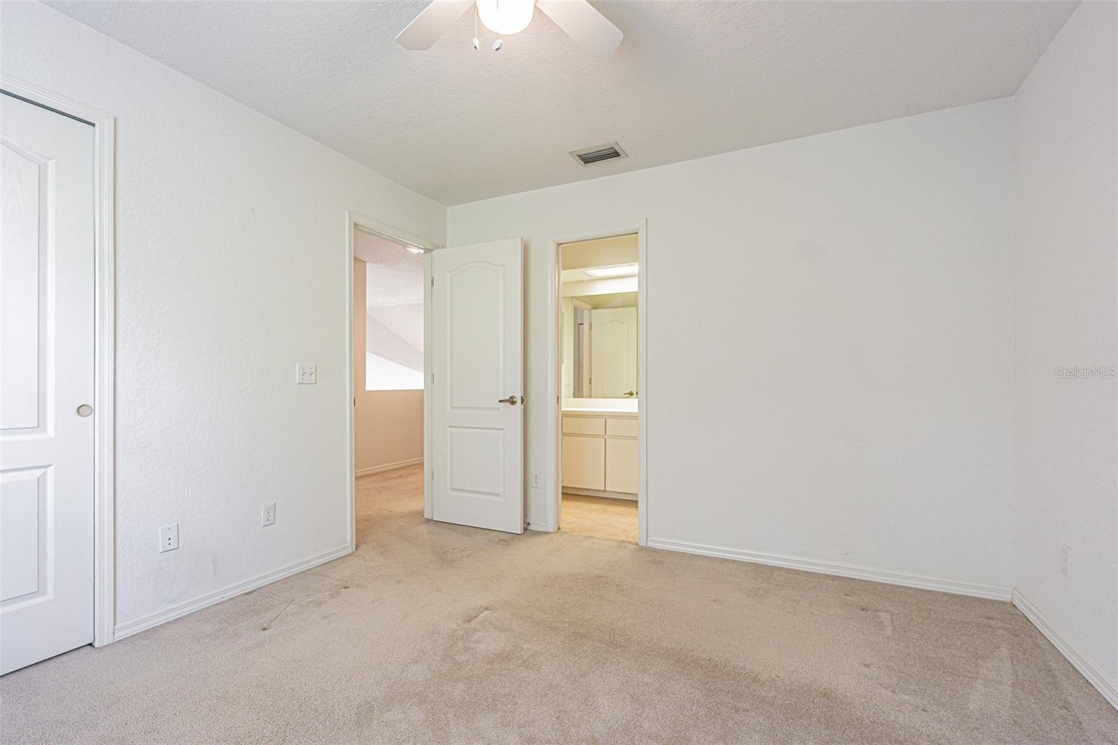 bedroom #1 with private pocket door entrance to bath