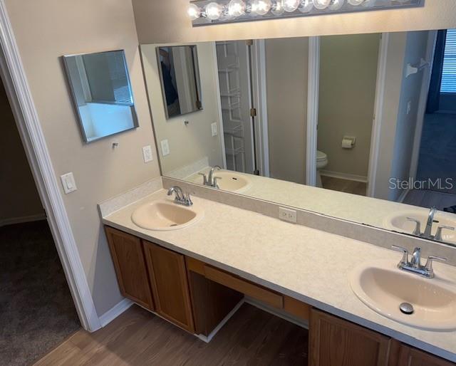 Master bedroom features a large vanity area and dual sinks.