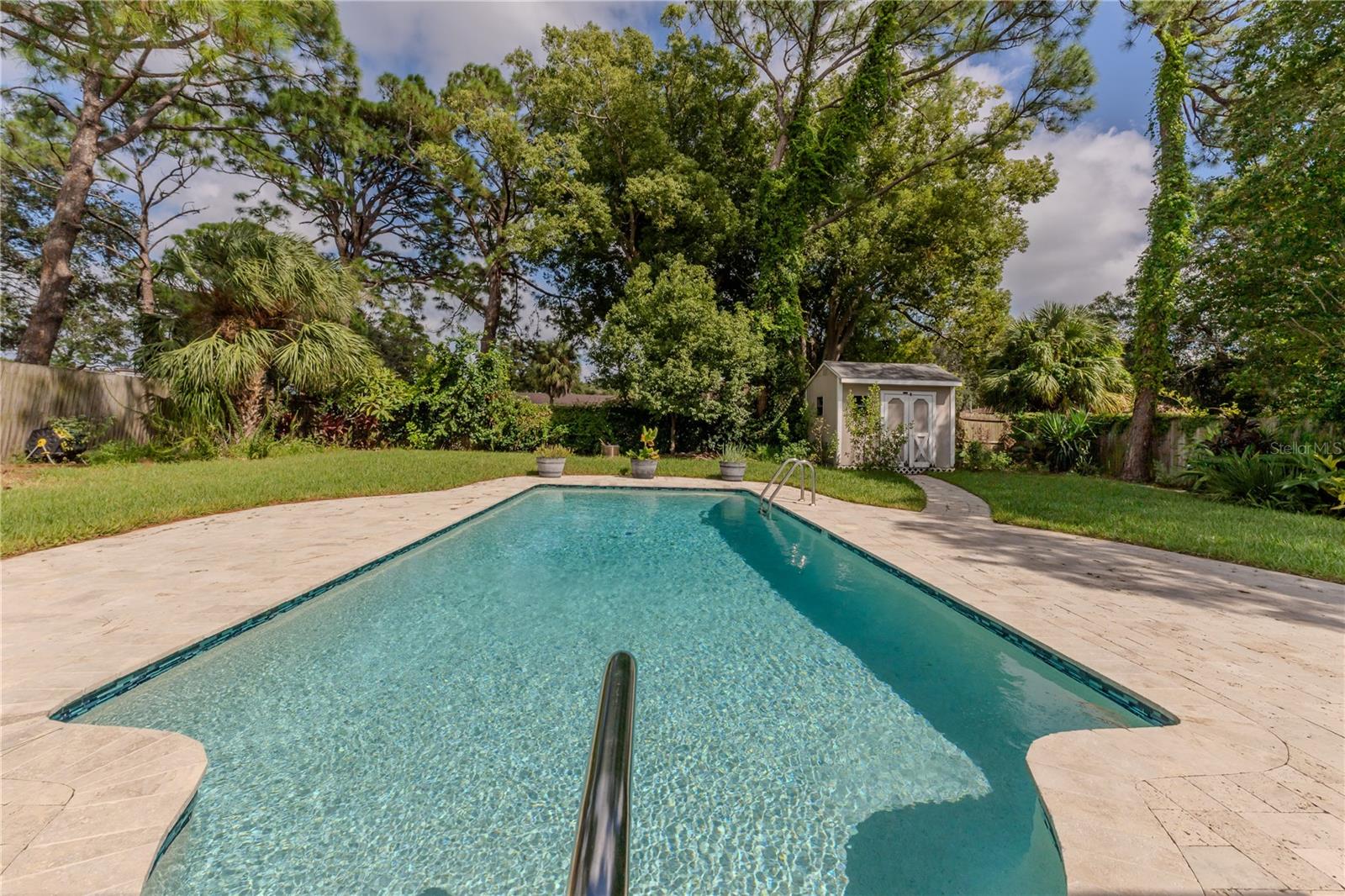 ENORMOUS POOL WITH TRAVERTINE DECK