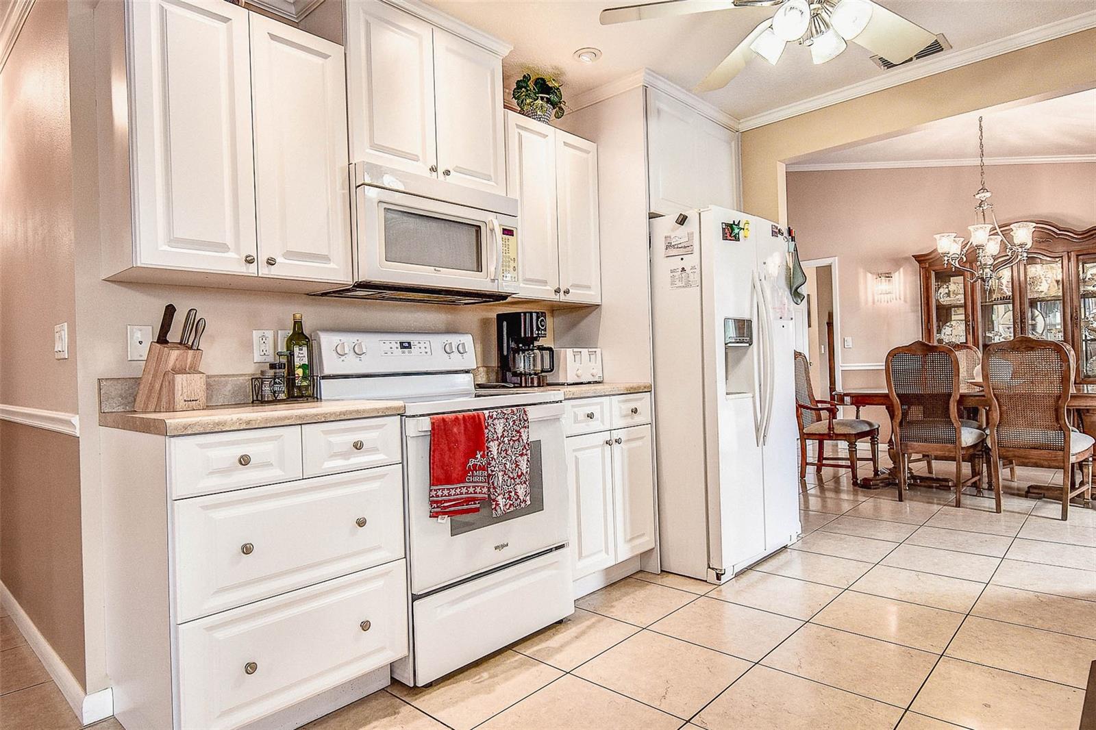 East side of kitchen (towards front door) and hallway to front door