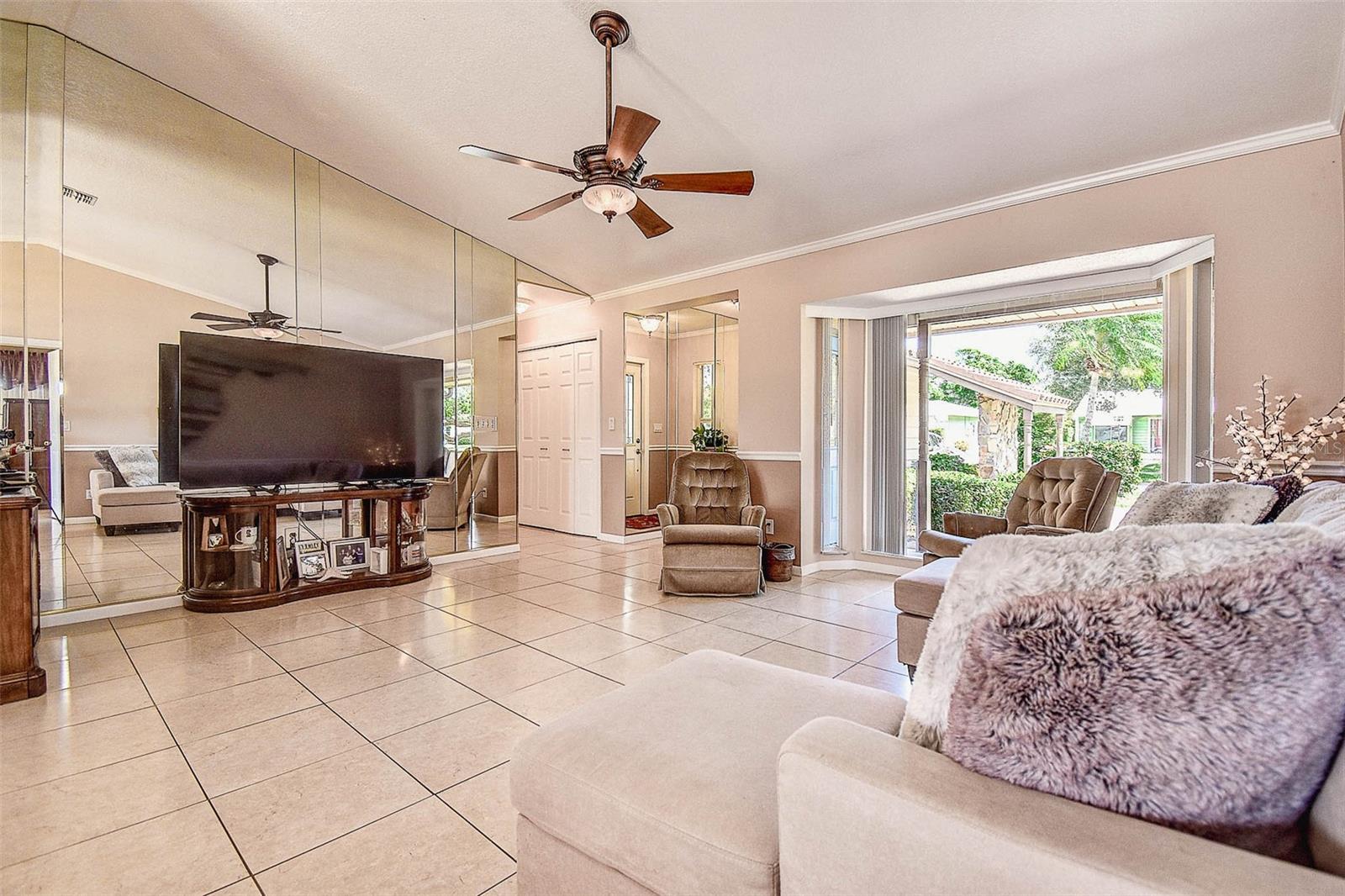 Large bay window and vaulted ceilings provide ample light