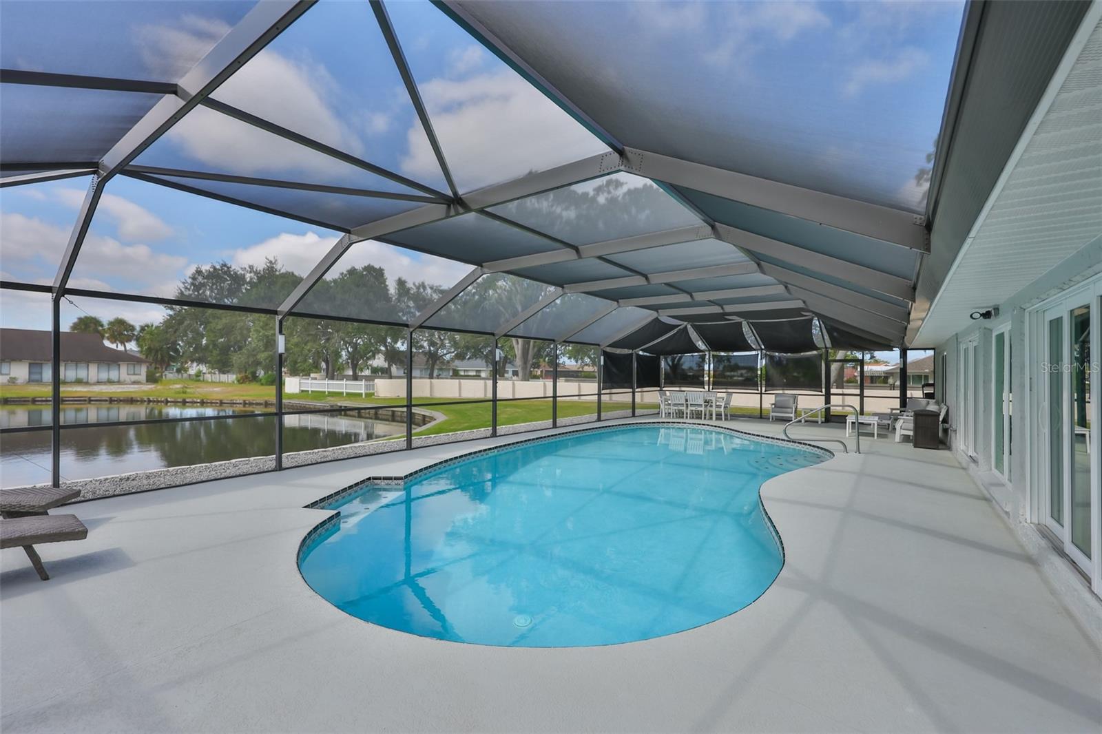Sparkling inground saltwater pool with a heater and lighting. This pool and deck have been resurfaced and all equipment is new.  It also boasts of a variable speed heater for maximum efficiency and cost savings.