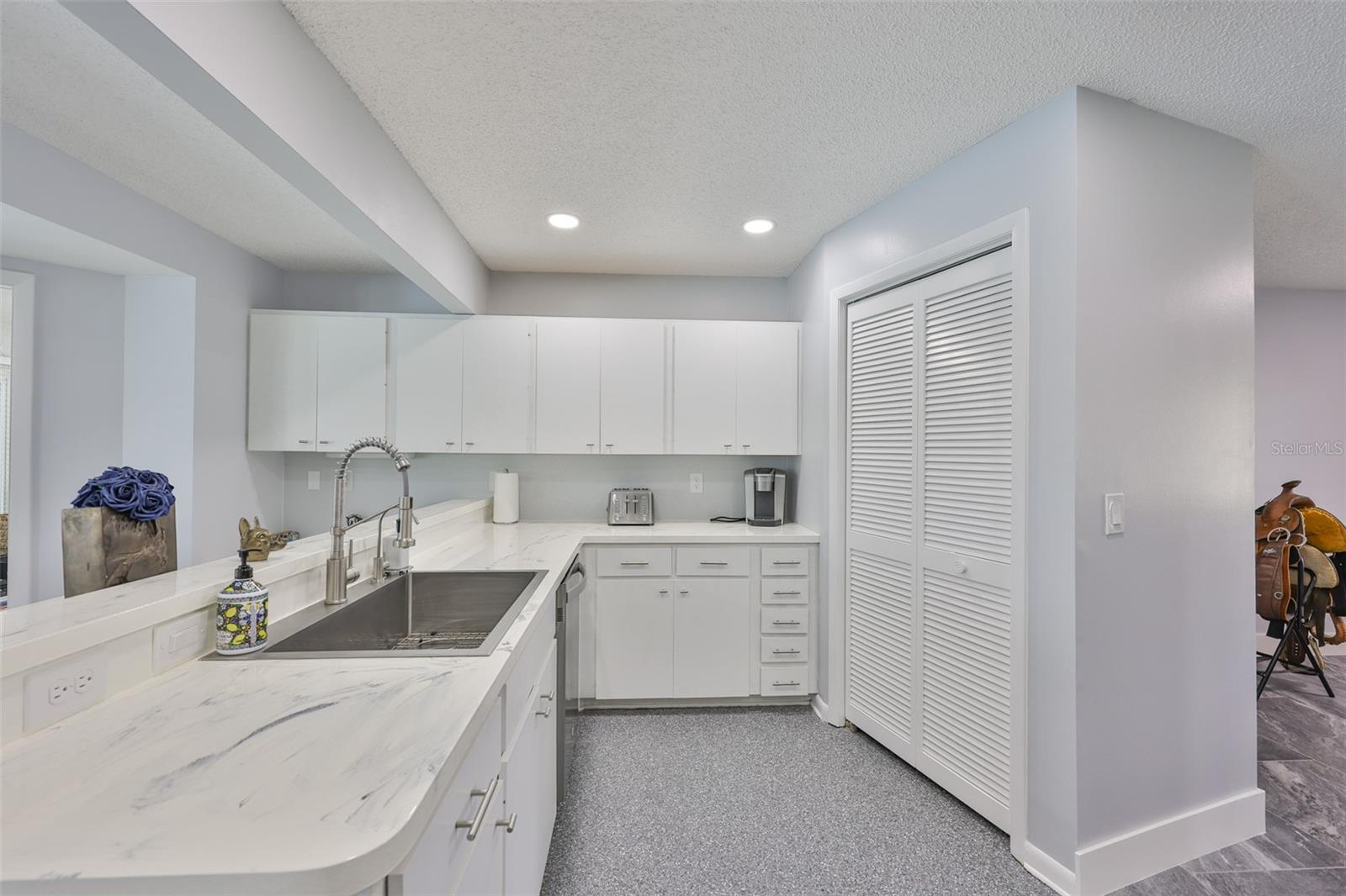 The kitchen includes a large pantry as storage.