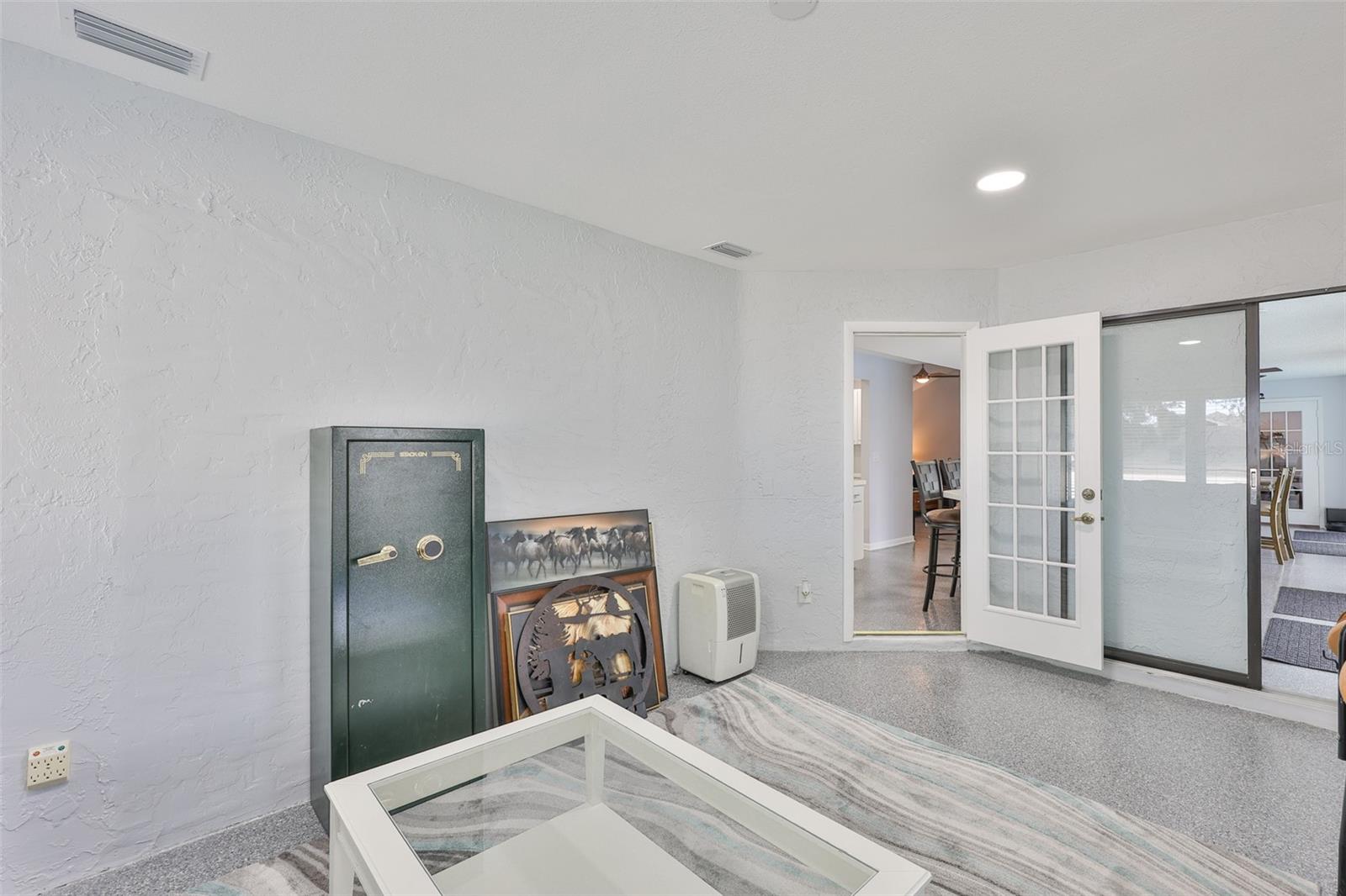 The bonus room flows into both the kitchen and the dining room for easy access.