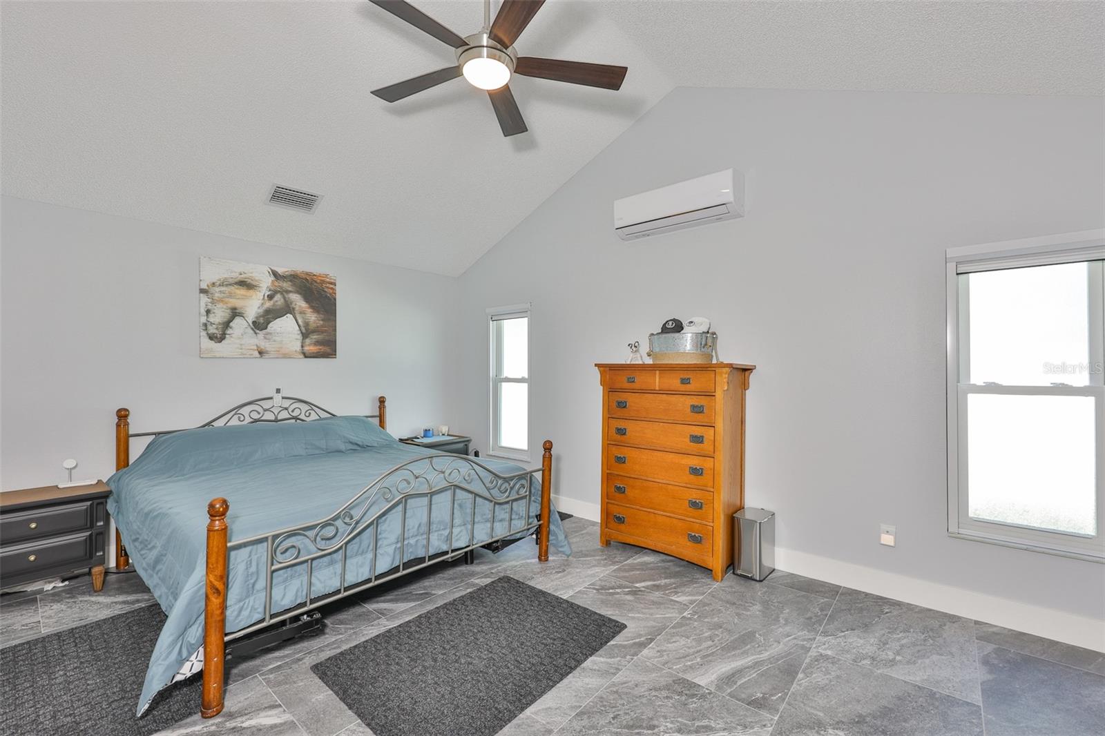 Master bedroom has all tile floors and no carpet with new fixtures and no neighbors out the windows.