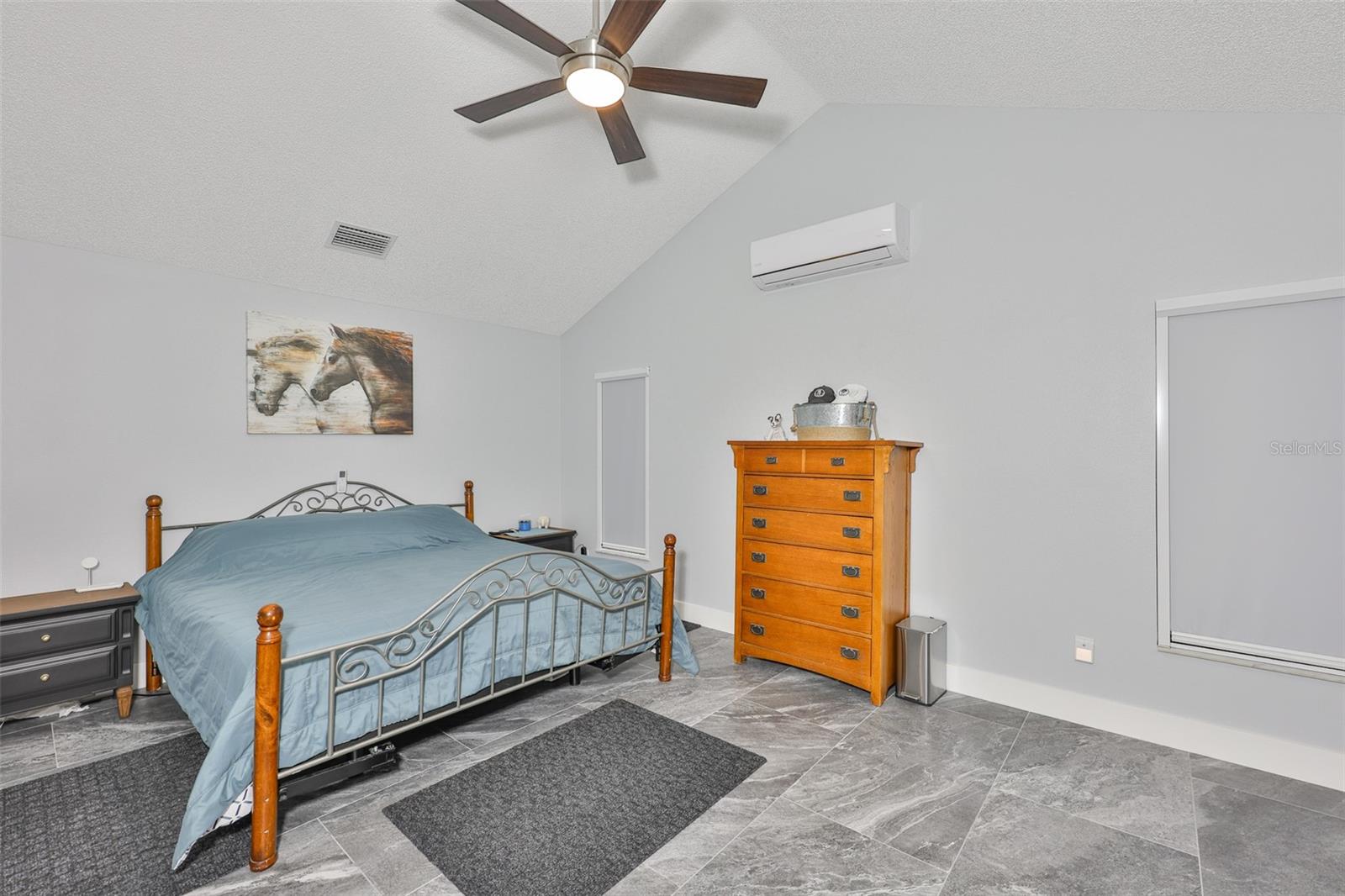 Large master bedroom has complete black out shades, perfect for sleeping in, along with a mini split, so that you only cool this room at night and not the whole house, if desired.