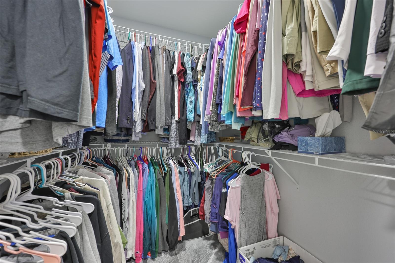 A large open walk in closet for storage.