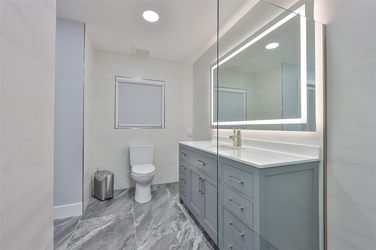 Beautiful new vanity and matching flooring in the master bathroom.