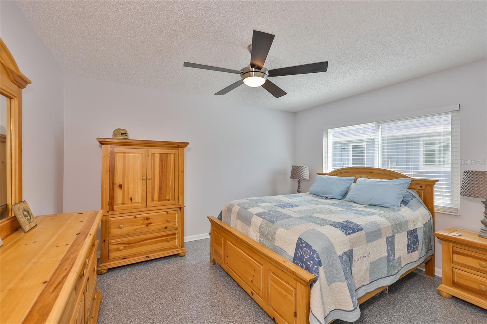 Bedroom 2 is sparling clean with epoxy flooring and large hurricane impact windows.