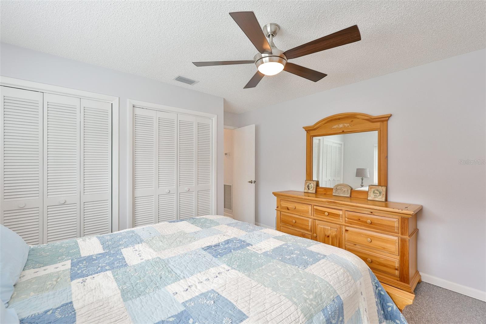 Bedroom 2 offers lots of storage with wall to wall closets.