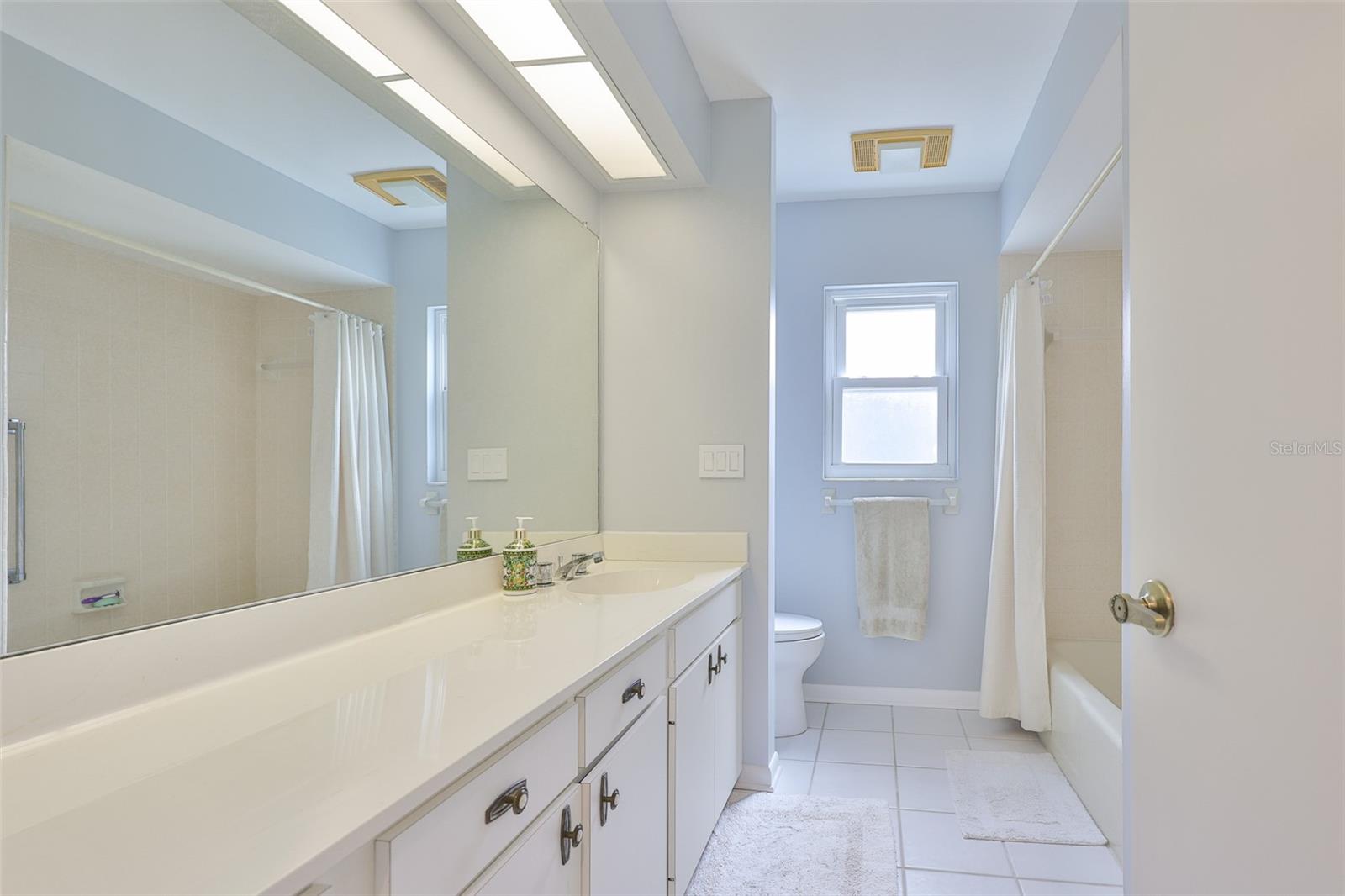 Guest bathroom is clean and spacious for guests.