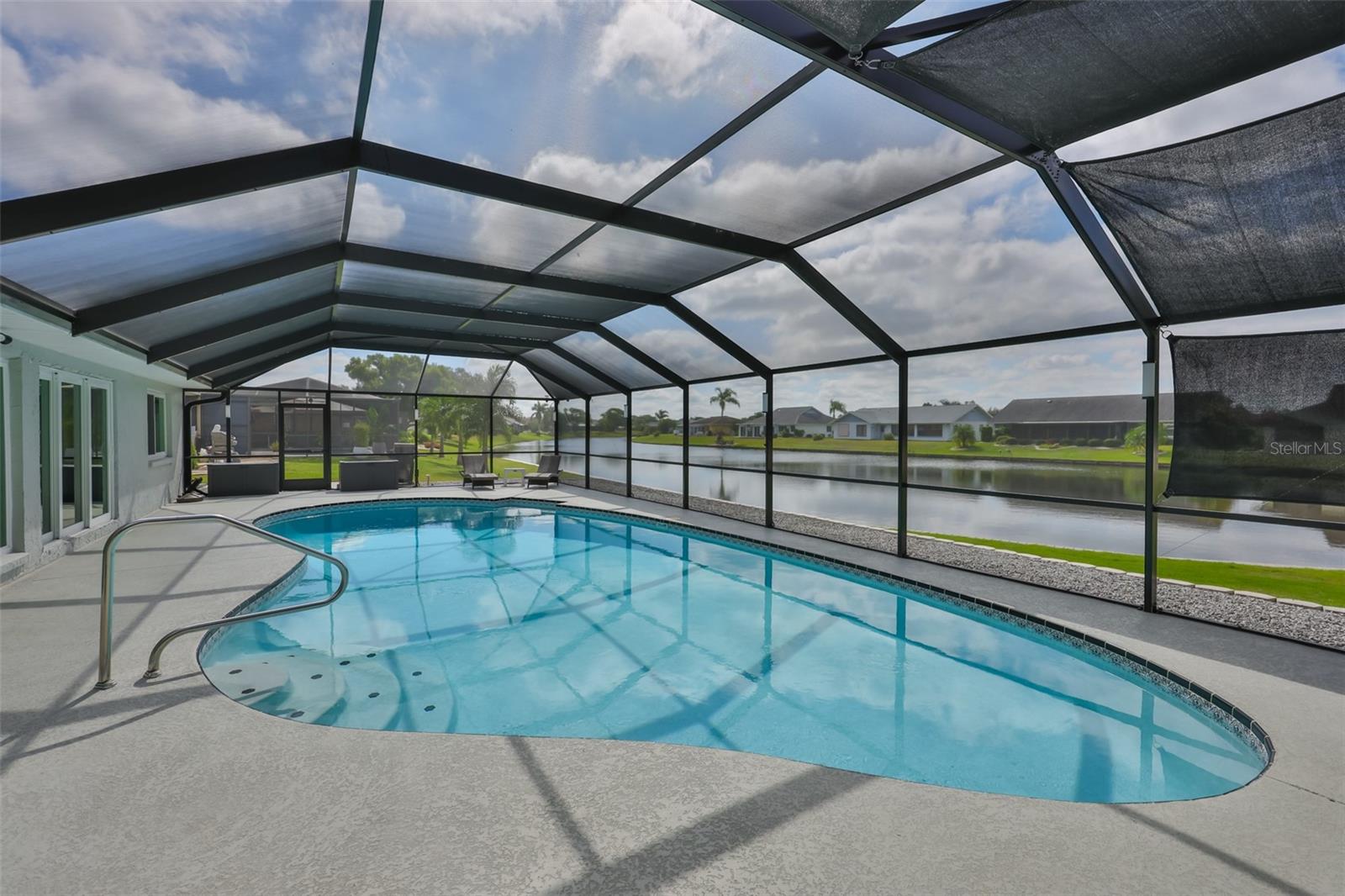 Saltwater, 25,000 gallon, heated pool is fully enclosed and ideal for entertaining or relaxing on sunny days.