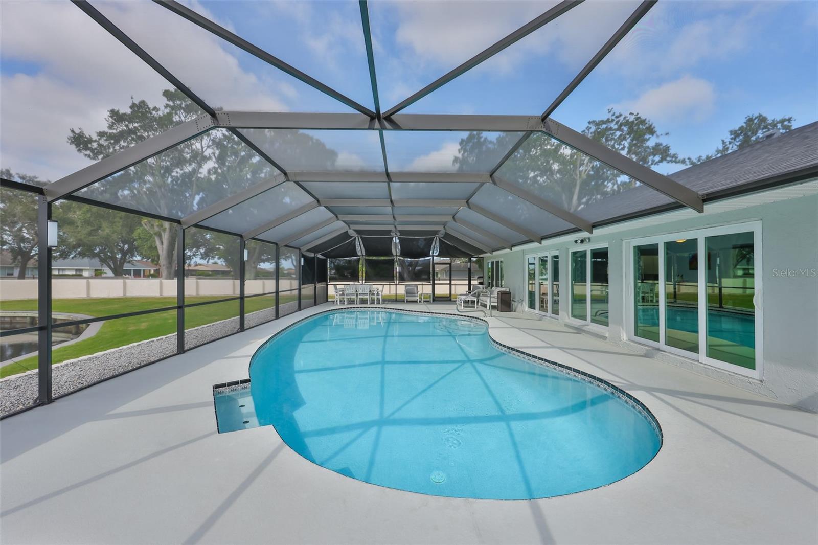Resurfaced deck and pool boasts of new pool equipment, variable pump and custom lighting.