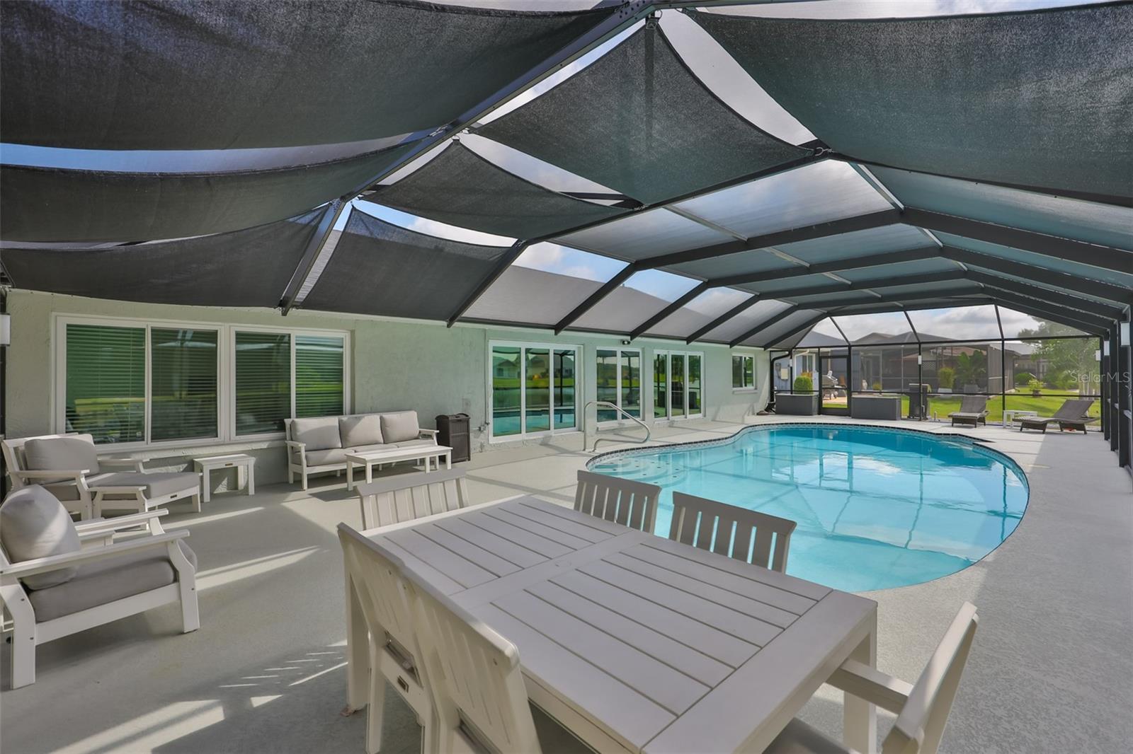 Gather around a screened in lanai for sunsets or entertaining guests.
