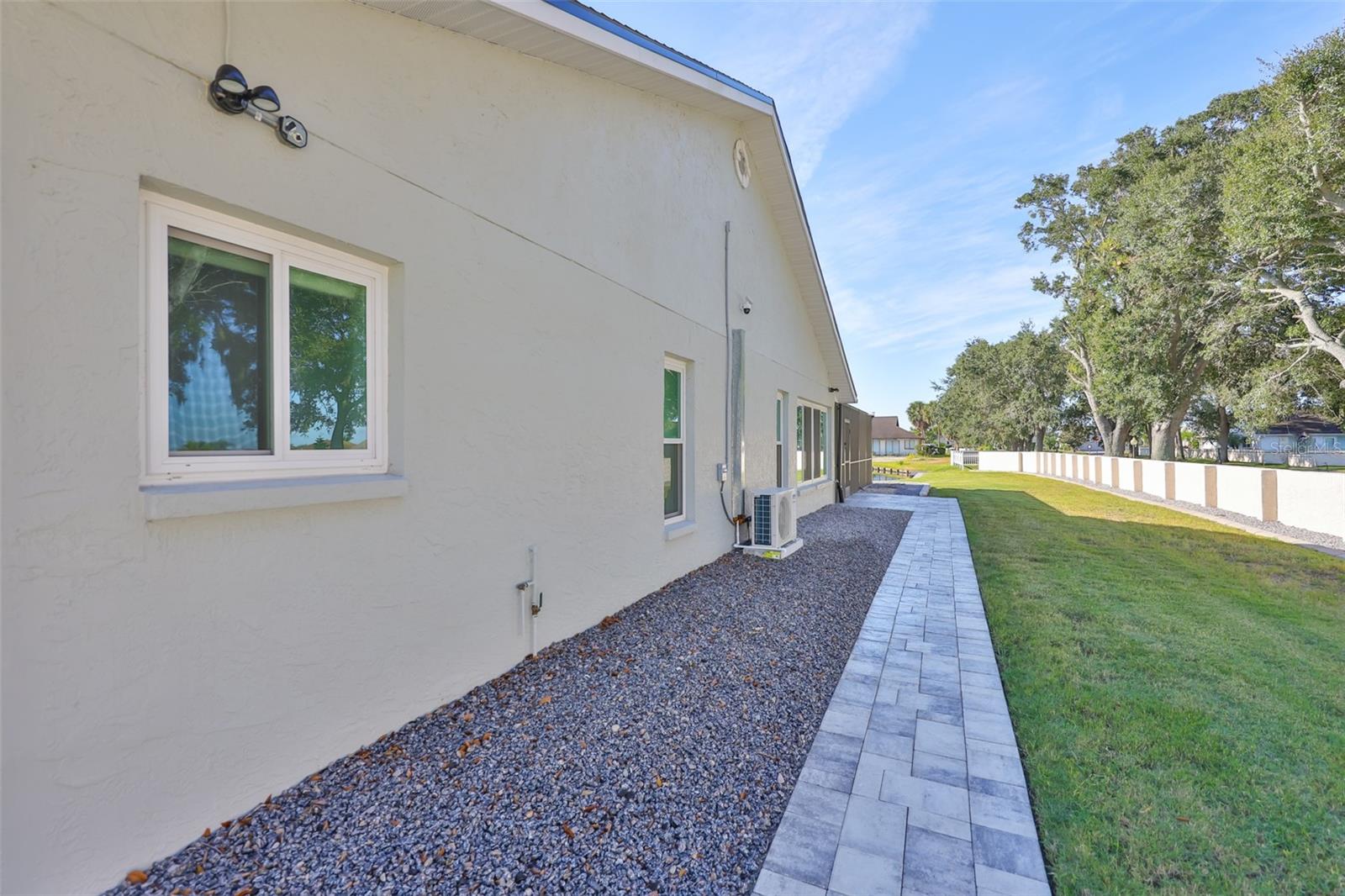 Manicured, pavered sidewalks are on BOTH sides of house.