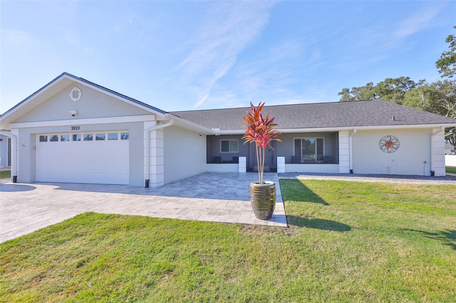 Discover this beautifully updated home set on a generous lot, offering the perfect blend of style, comfort, and outdoor living. The front porch area is screened for protection from the elements.