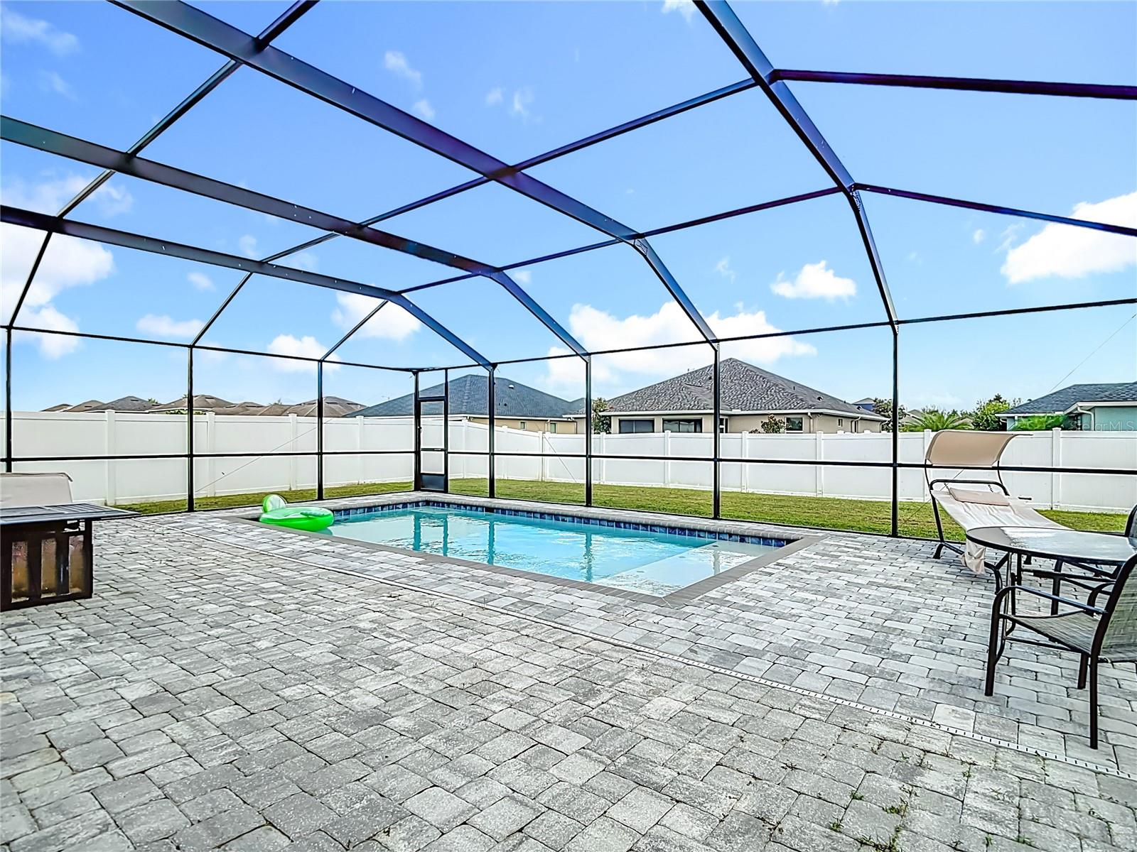 Pool with Pool Cage and paver deck completed in 2023