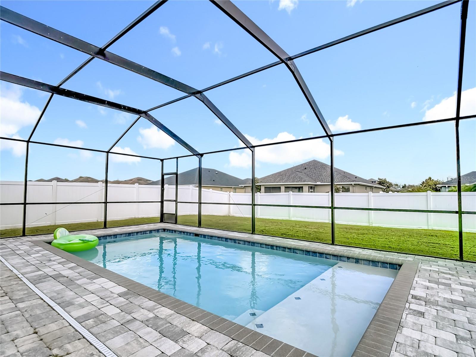 Pool with Pool Cage and paver deck completed in 2023