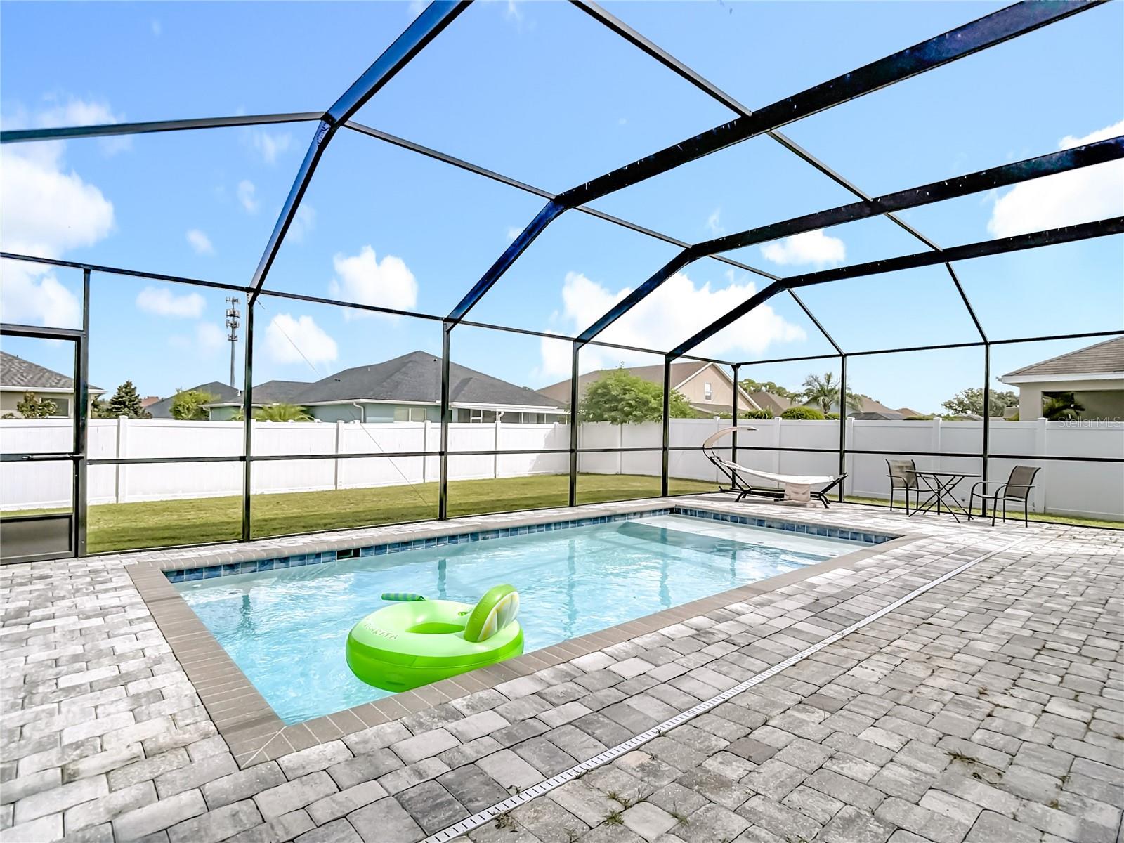 Pool with Pool Cage and paver deck completed in 2023