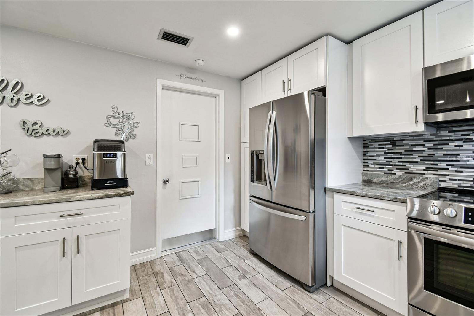 Coffee Bar and entry door to garage.