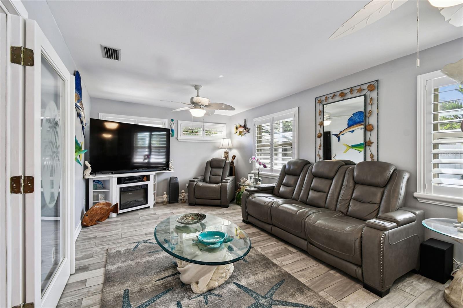 Family Room with Custom wooden shutters which are throughout the home.