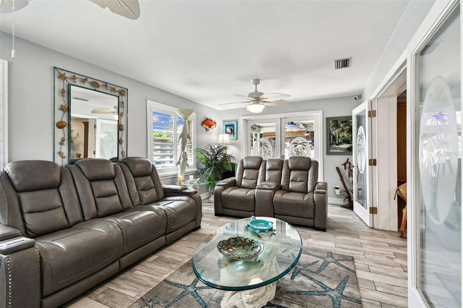 Sun filled family room with access to the outdoor living spaces.