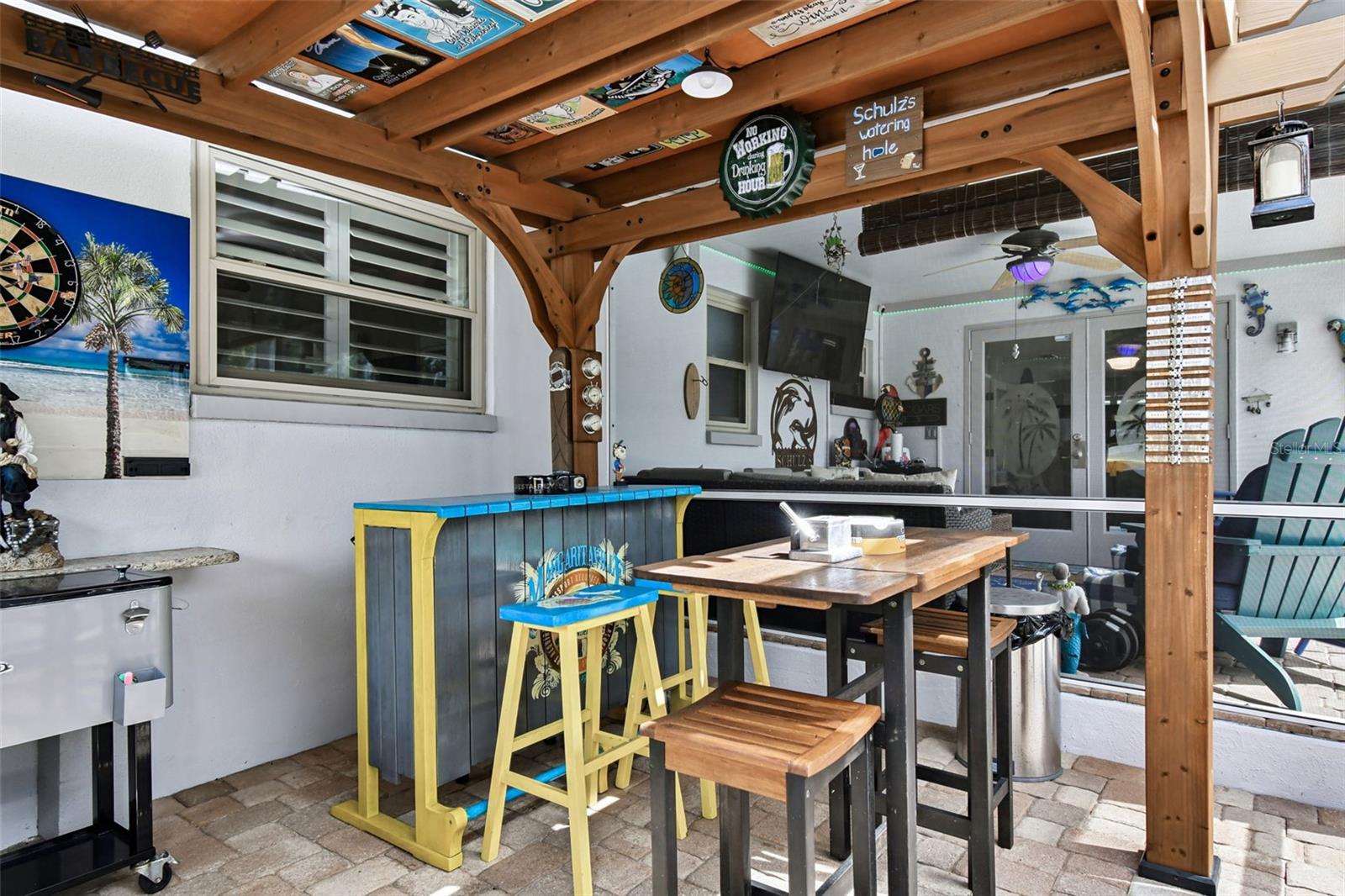 Outdoor kitchen area under trellis