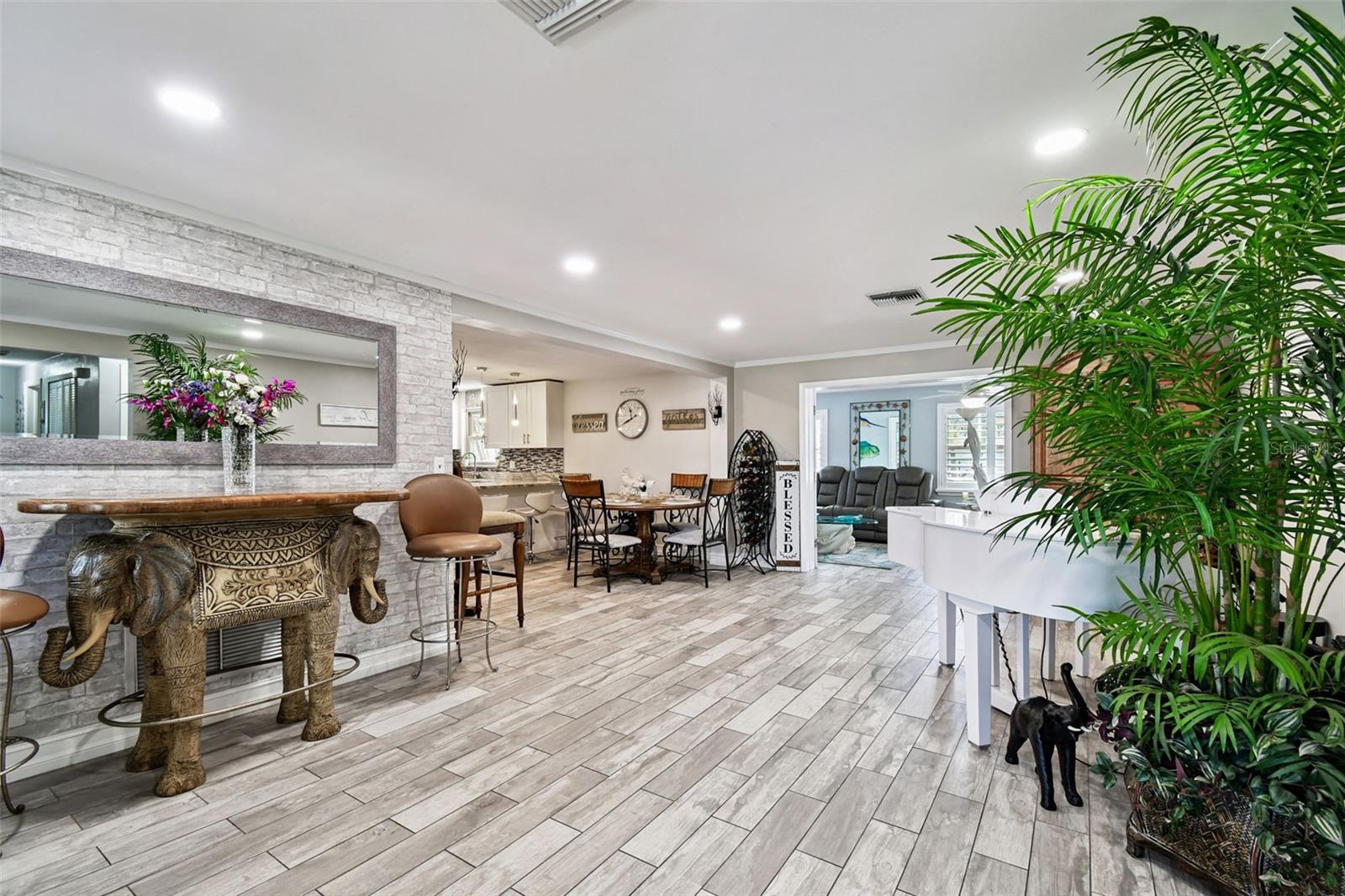 The great room opens to the kitchen and family room.