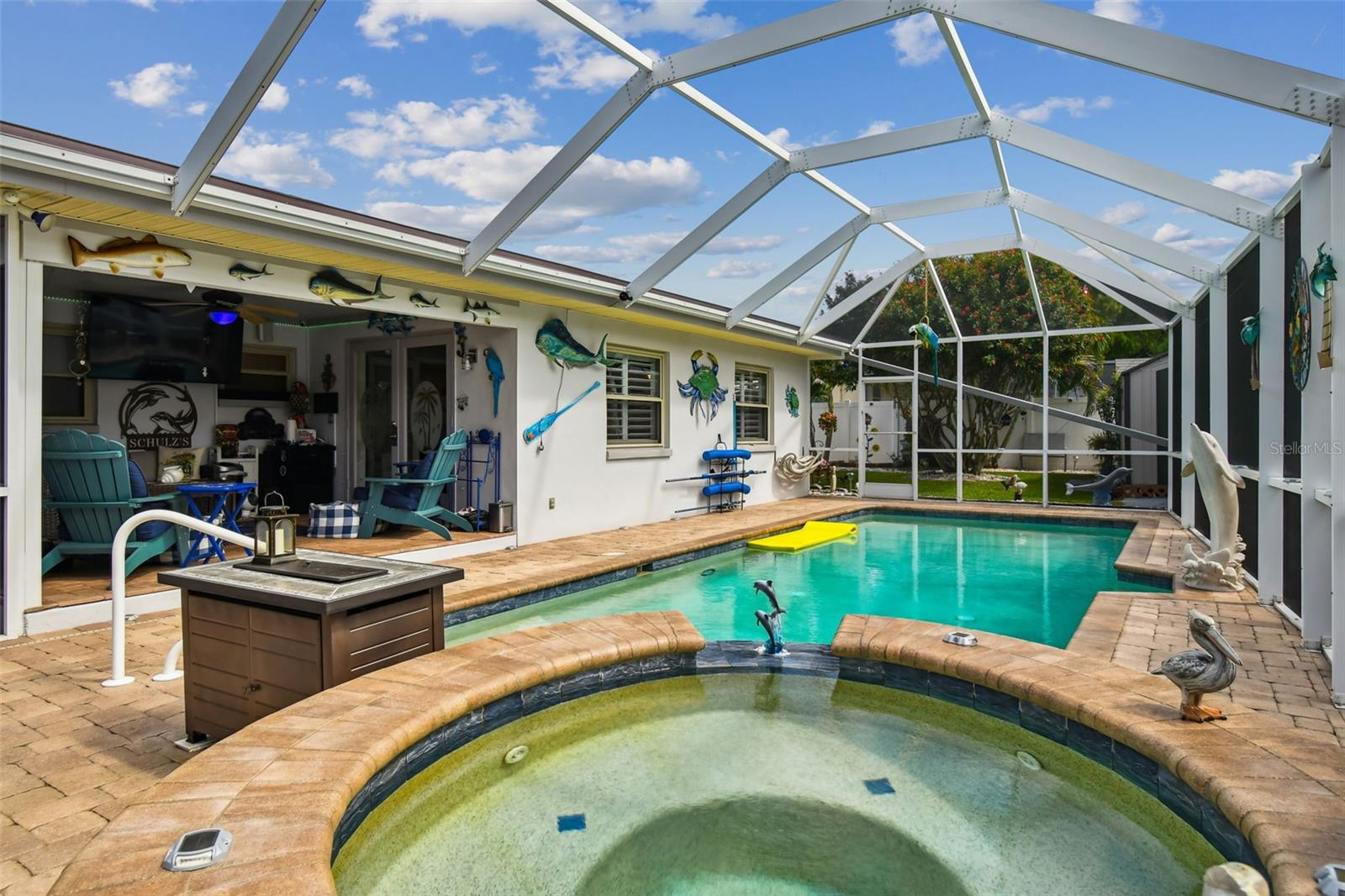 View from the spa of pool and outdoor living room.