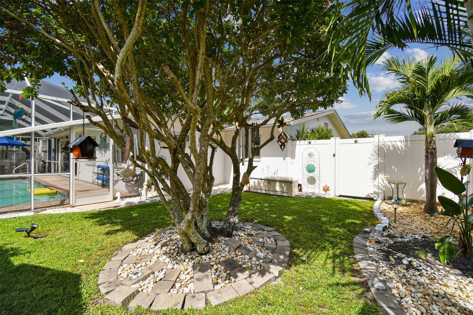 Vinyl fence enclosed backyard.