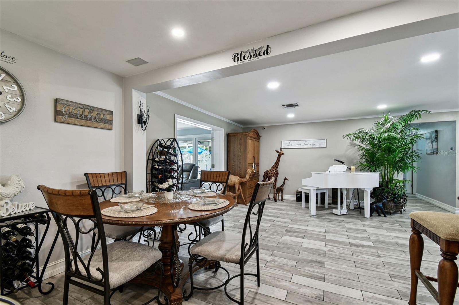 Dining area looking over the great room.  Notice the porcelain tile flooring that is throughout the home.