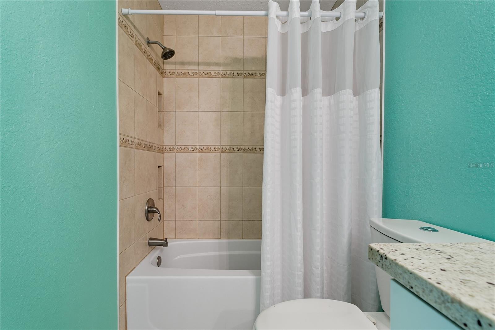 SHOWER/TUB COMBO IN THE PRIMARY SUITE!